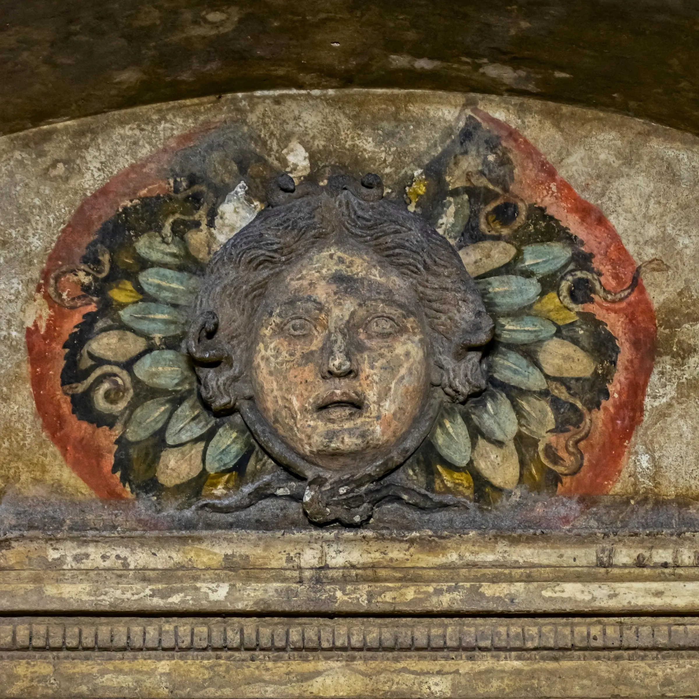 Carved Medusa head inside the Hypogeum